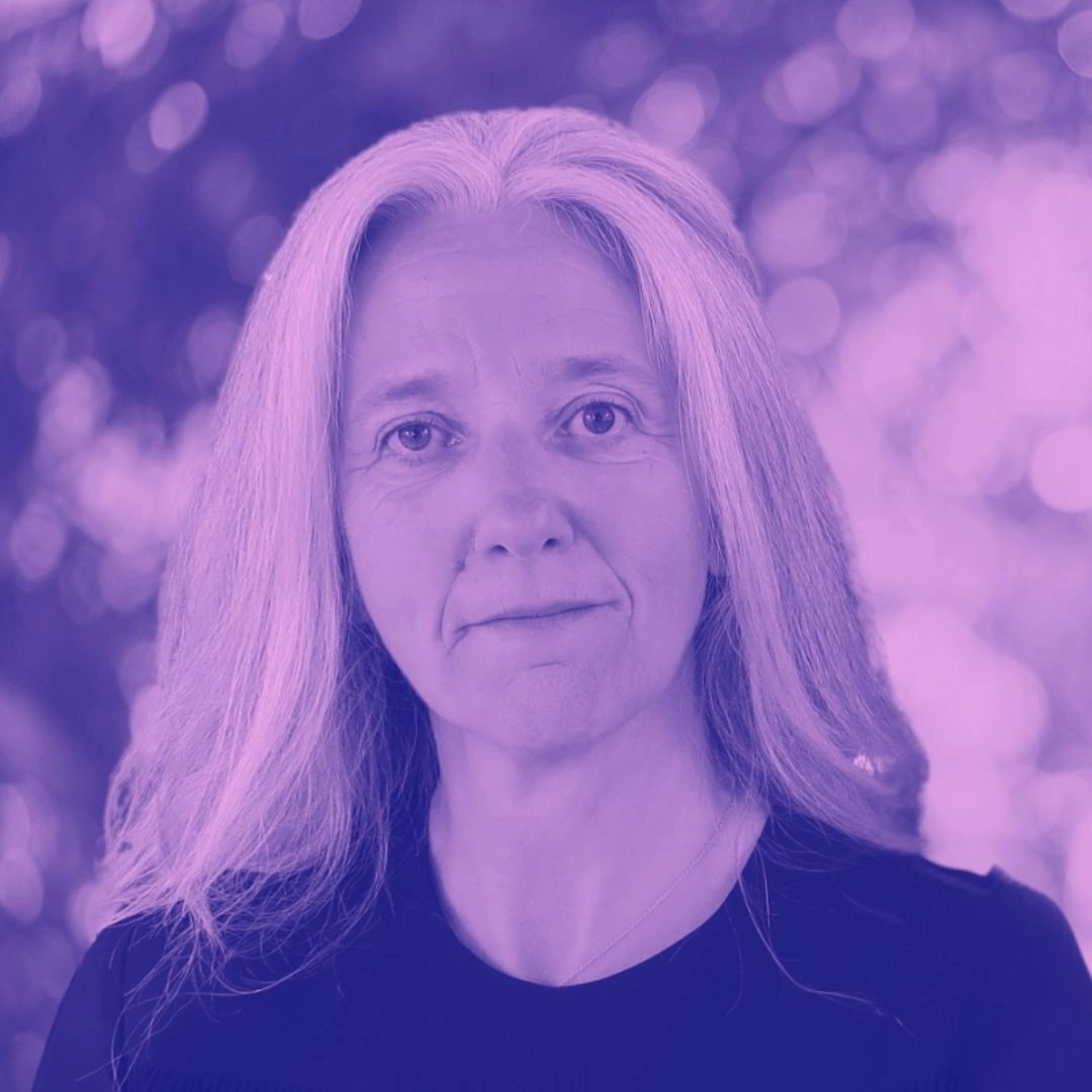 Portrait of a Beyond Animal Research co-founder with long light hair, purple colour overlay and blurred background.
