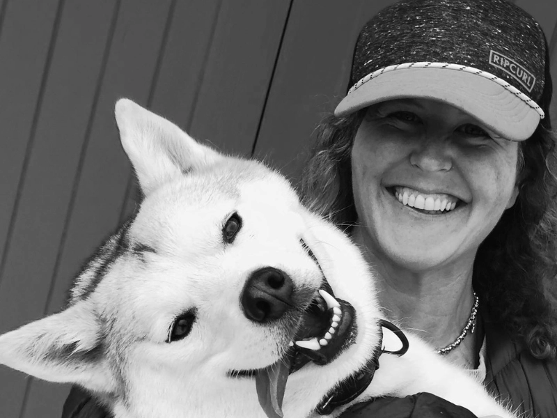 Woman spending time with her dog, representing a future without animal testing