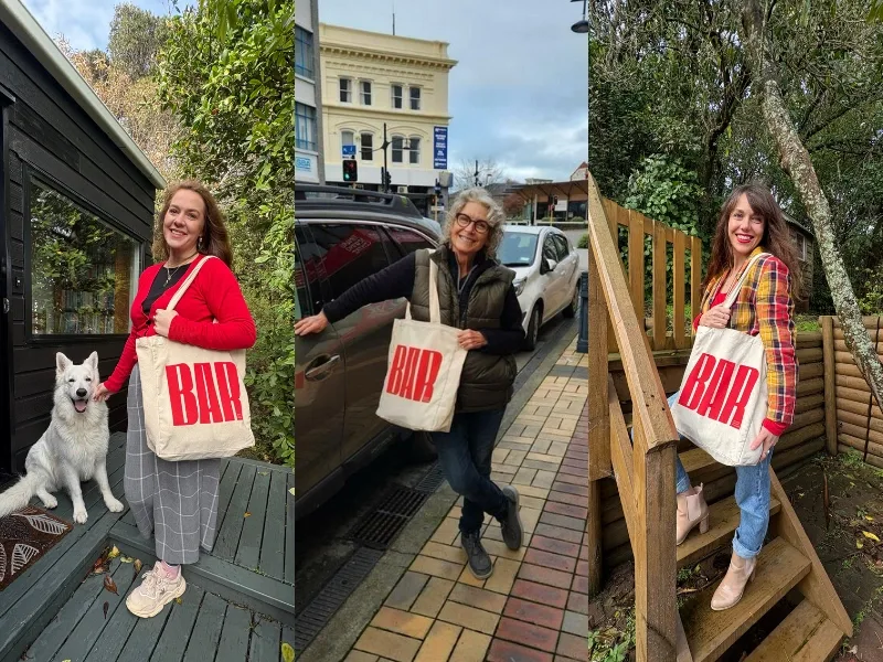 People holding Beyond Animal Research tote bags, representing collaboration with scientists and supporters